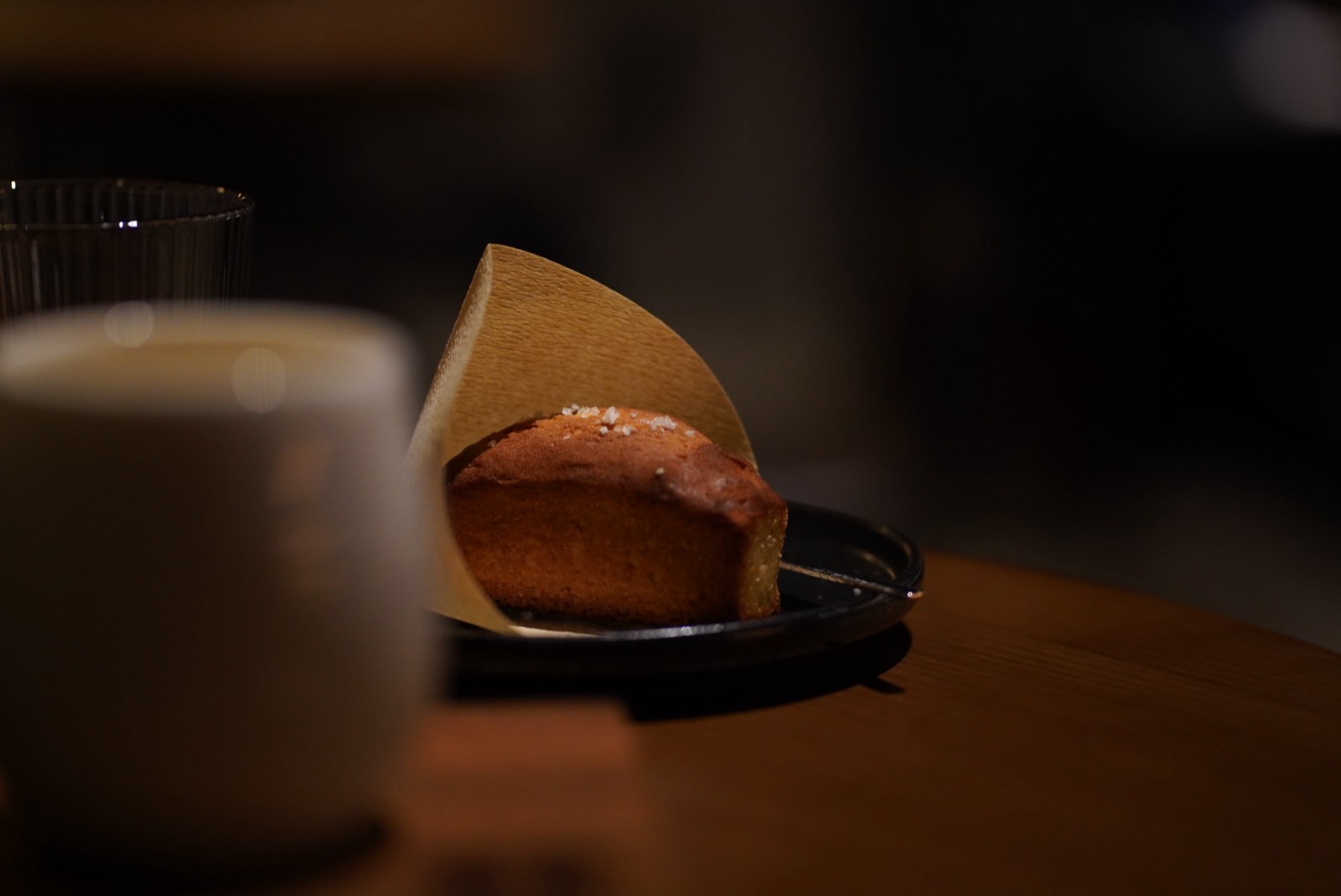 Tea and dessert seen across a shallow field of focus